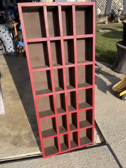 Solid wood organizer - 20 inches wide/ 4 inches deep /. 48 inches high / has 24 cubicals