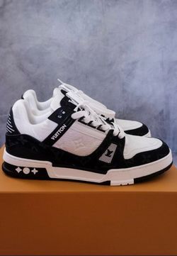 With and black LV trainers