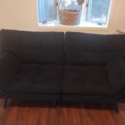 Like new very nice modern black upholstered futon bed/couch