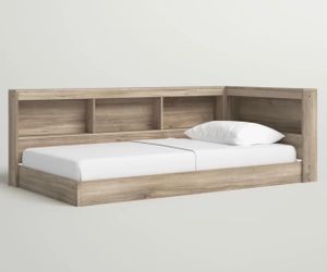 Twin floor bed with shelving
