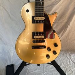 Oscar Schmidt by Washburn gold top Les Paul style guitar