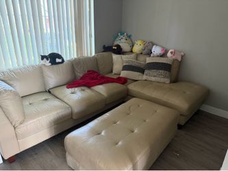 beige leather sectional with ottoman