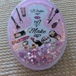 (NEW) OVAL COMPACT MIRROR WITH FLOWING, SPARKLING GLITTER AND A "WAKE UP AND MAKE UP" DESIGN