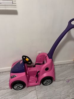 Toddlers push car
