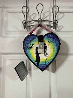 Disney The Nightmare Before Christmas Heart Crossbody Bag with removable strap.  Size of purse approximately 7 1/2 inches long without handle and 7 1/