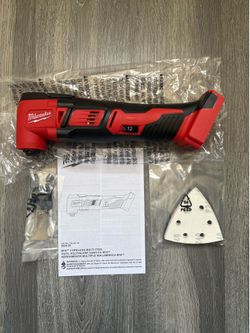 Milwaukee M-18 Cordless Multi-Tool 2626-20 W/ Attachment shown