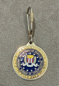 LLavero metálico de el Buró Federal de Investigación (FBI)