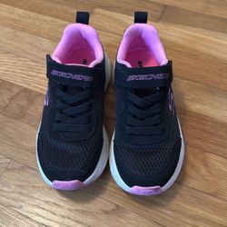 Pink and black Skechers