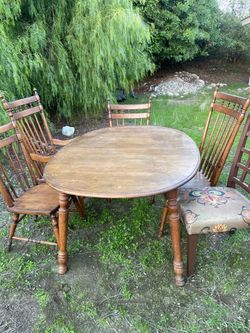 A large size dinner table for 6 persons with 5 chairs Size L 5 ‘ w 42 “