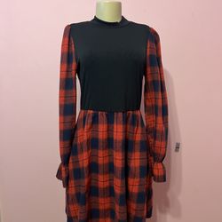 Chic dress with a black top and red checkered skirt