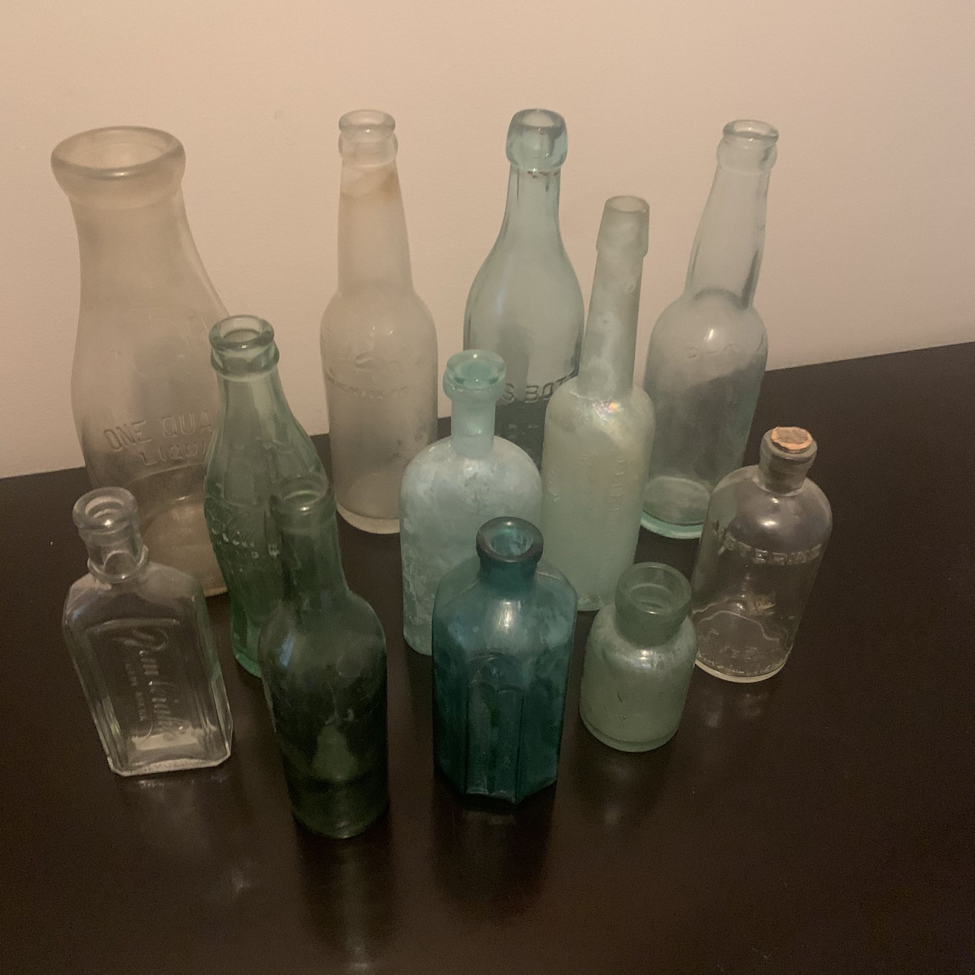 A Collection of 12 Antique Glass Bottles