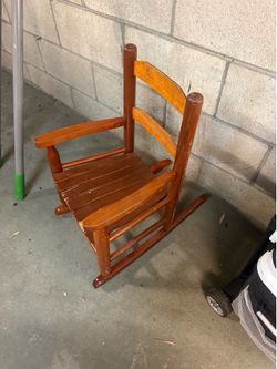 Vintage wooden child’s rocking chair