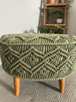 Green ottoman with wooden legs