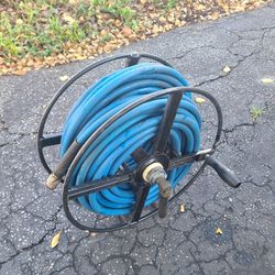 manual 50ft air hose reel and good air hose