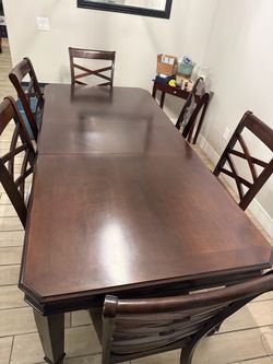 Dark Wood Dining Table with 6 Chairs with removable center piece.