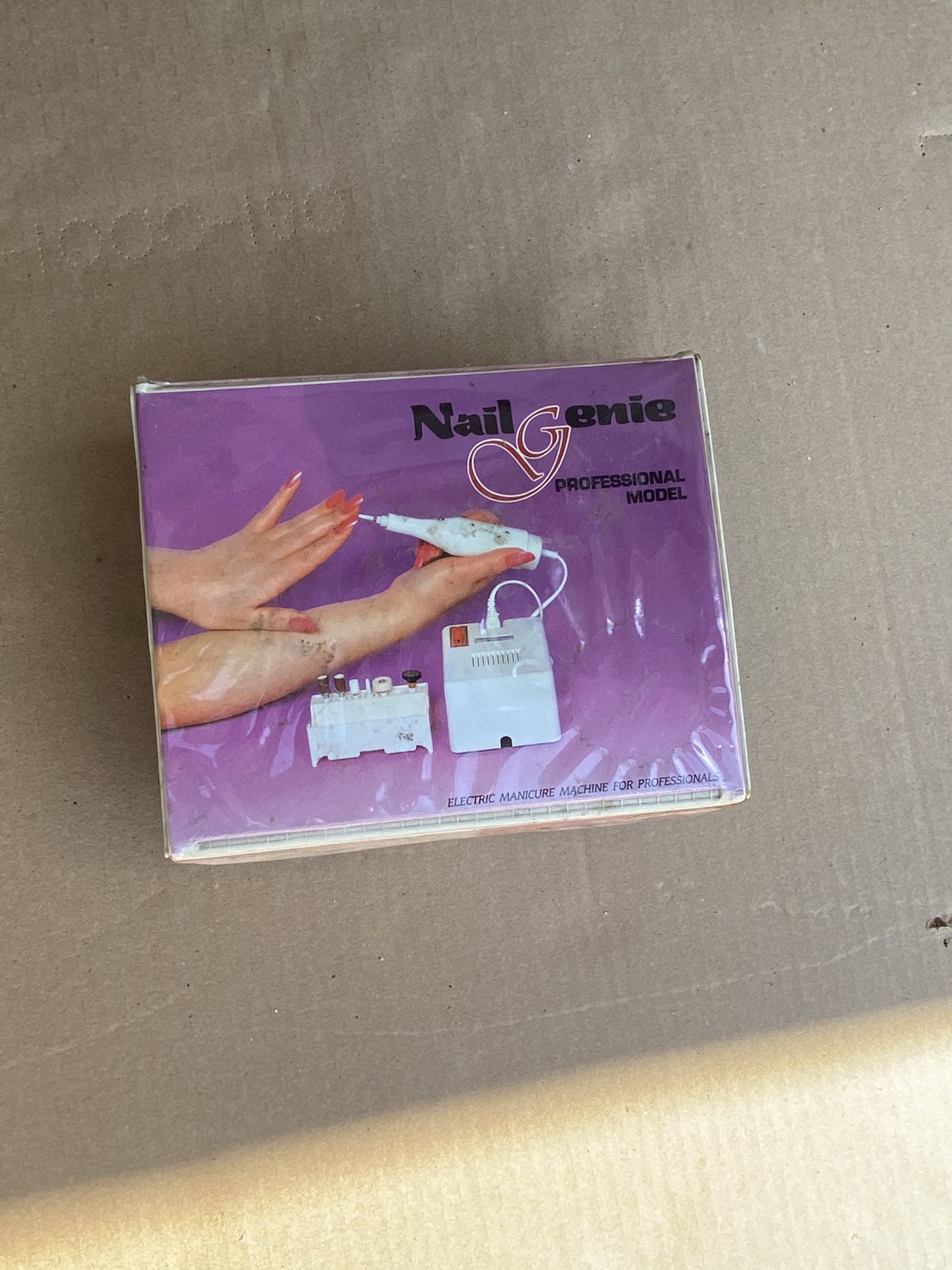 Nail Genie electric manicure machine.