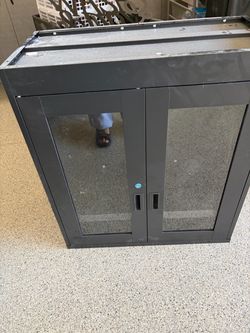 2 / Storage cabinet with two adjustable shelves