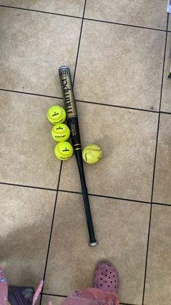 Softball balls and bat