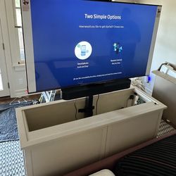 TV cabinet with lift-up stand
