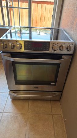 LG oven with five burners 1 warming zone.