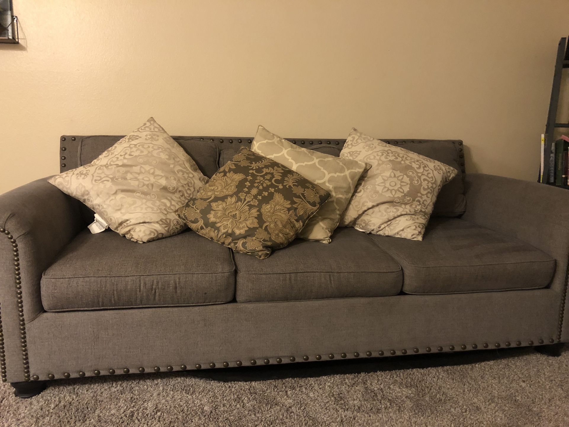 Comfortable 8x3 grey couch with free pillows included