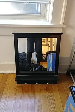 Black mirror with 3 hooks and one shelf