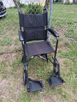 VERY NICE  FOLDABLE WHEEL CHAIR