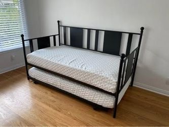 Day bed with trundle and two twin mattresses