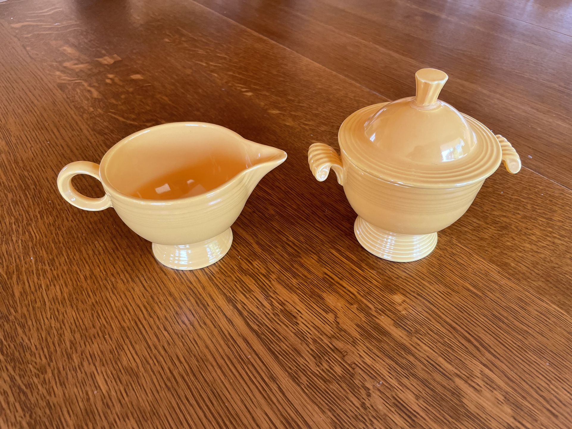 Vintage Fiestaware covered sugar bowl and creamer