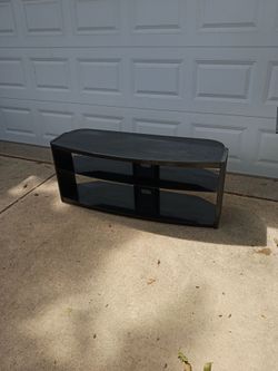 Black entertainment center with three shelves