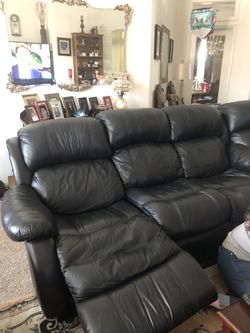 Black Italian leather sectional reclining couch