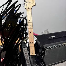 Squier Stratocaster HSS and Roland JC40 amp
