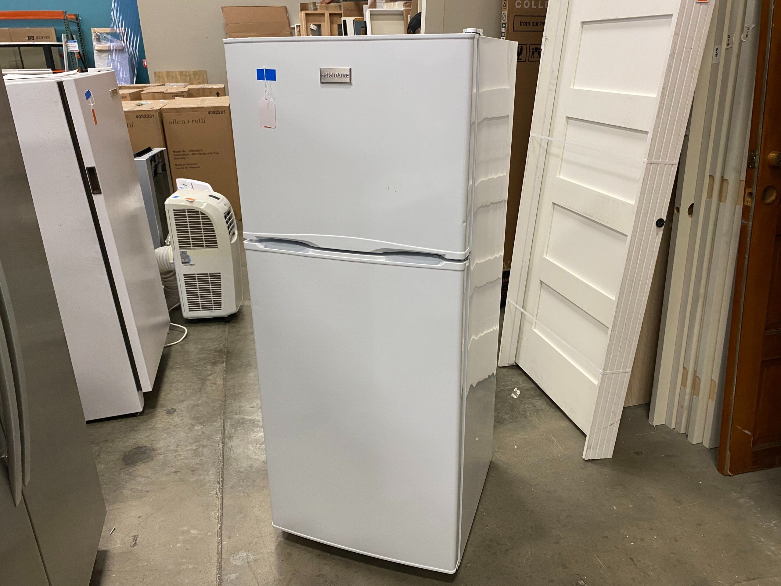 FRIGIDAIRE Medium Sized Refrigerator Freezer Model #FFTR1022QW1