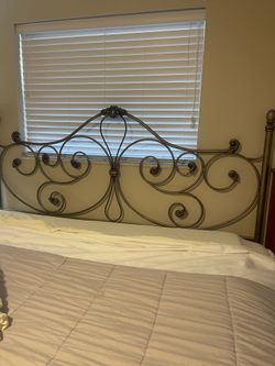 Bronze and silver king sized headboard and bed frame