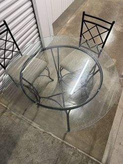 Glass Dinning Table With Iron Chairs