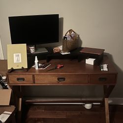 Desk with raised monitor stand