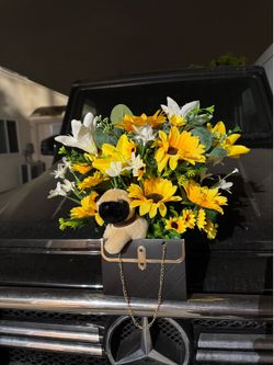 Artificial Sunflower and Lily Floral Arrangement in Gift Bag with Plush Pug