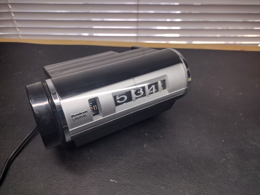 Vintage Black Chrome Sankyo Roll Clock Model 412