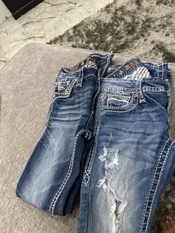 Two size 25 rock revival one is boot cut the other one is skinny asking 50 each women