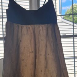 A Gold And Black Dress With A Pattern Throughout The Bottom. V Line Neck.