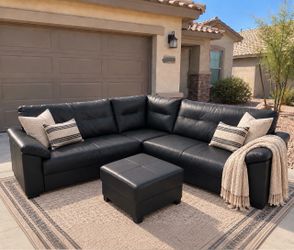 Living Spaces Black Leather Sectional With Storage Ottoman - Delivery Available