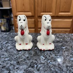 Ceramic Vintage Ceramic Shawnee 1950’s White Dogs with Red and Black pair  of Salt and Pepper shakers.  Preowned with original cork stoppers.  Has bee