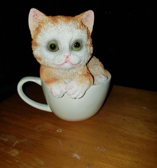 NEW CERAMIC CAT IN CUP. SOLID ALL THE WAY THROUGH.