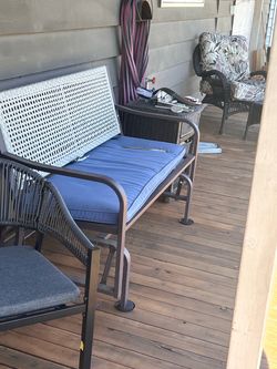 Outdoor rocking bench seat never been out from under cover