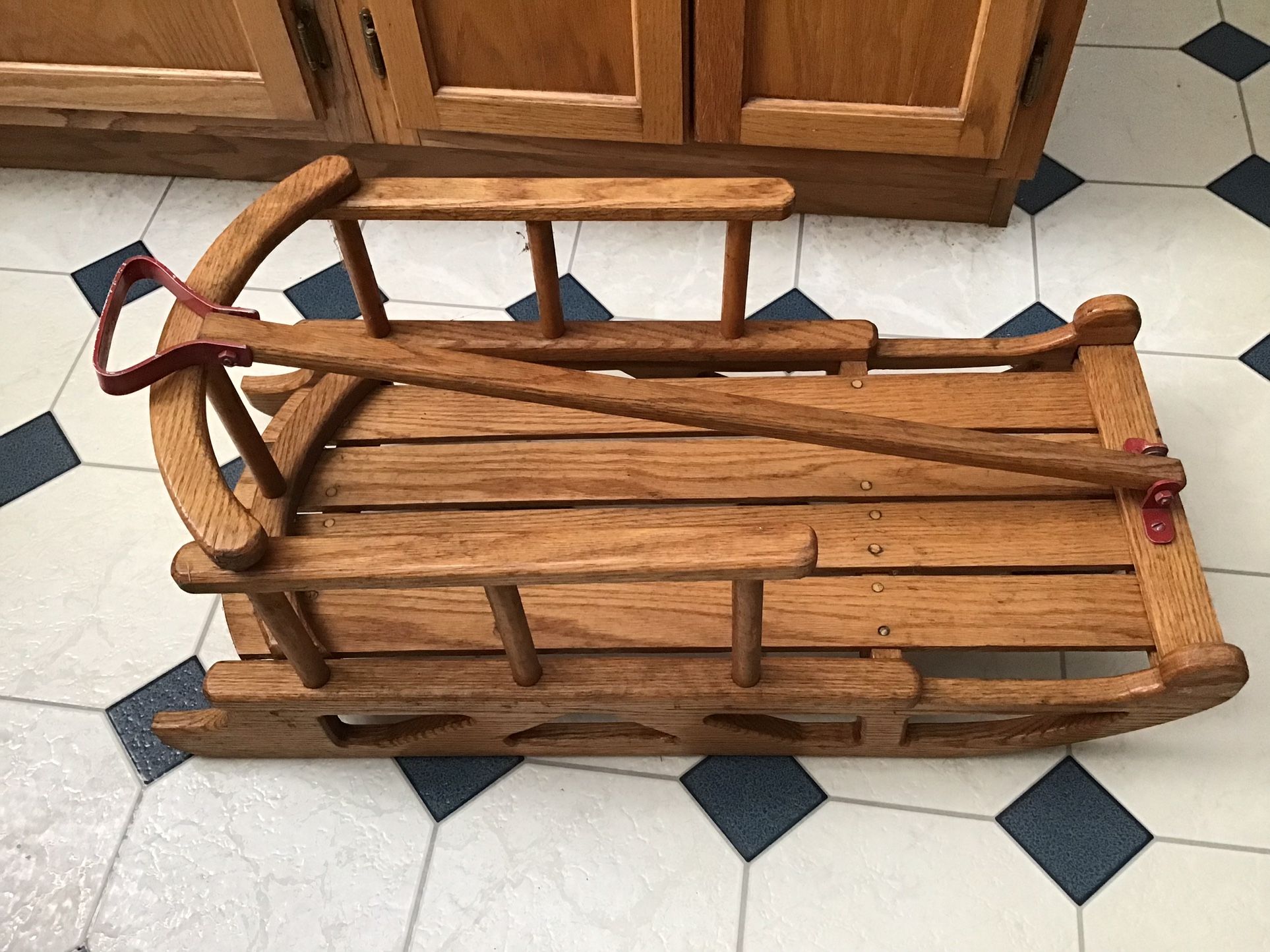 Handcrafted solid oak Childs pull behind sled, 29” long X 14” wide 12” high excellent condition