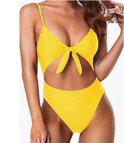 Yellow one piece bathing suit with cut outs and front tie