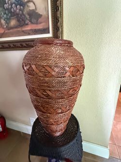 Unique wise vintage cylinder floor vase featuring tightly coiled bamboo rope and a crisscross woven pattern
