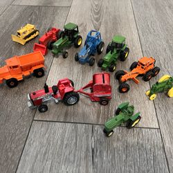 Vintage metal  Mini tractors lot of 10 asking 30 dollars for all of them 