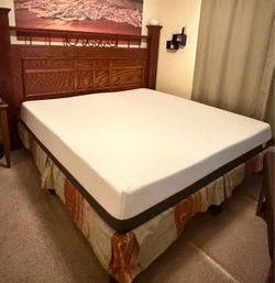 California King bedroom set featuring a wooden headboard designed to be wall-mounted, separate from the bed.