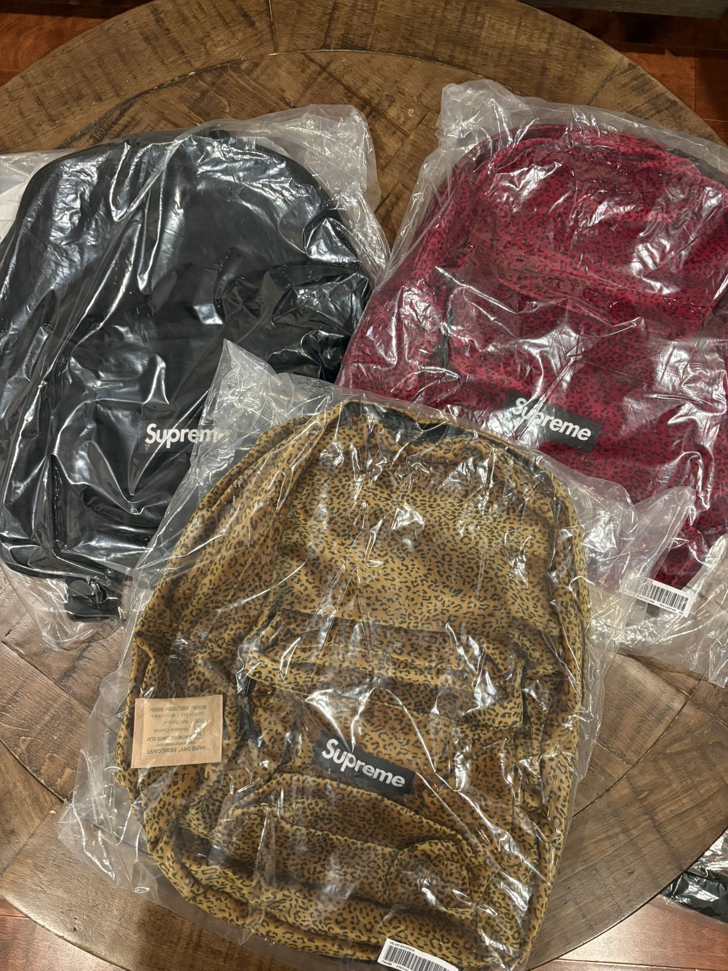 Supreme FW25’ Week 11 Supreme Velvet Backpack Red Leopard, & Denim Backpack